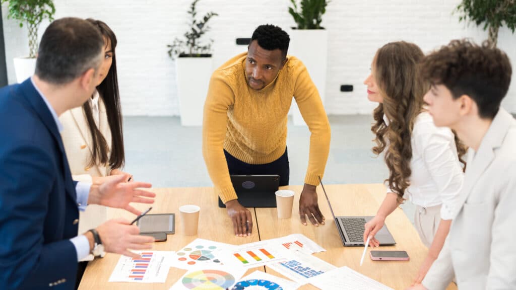 Black male team leader business meeting office scaled