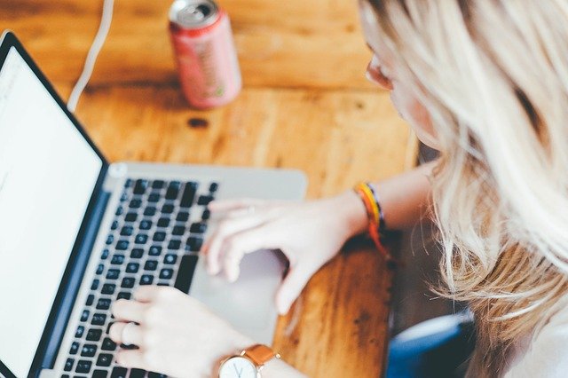 Woman researching project management software cost