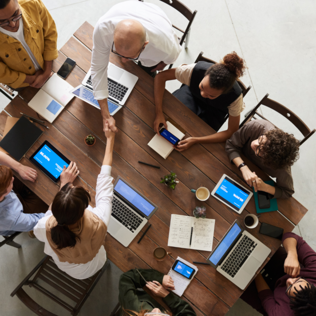 A team of people showing how essential the human touch is to project management.